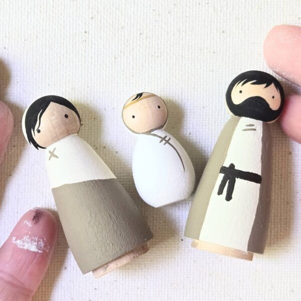 Three hand painted wooden peg dolls. Mary, Joseph, and Jesus