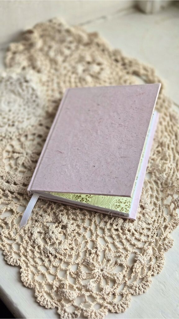 A pink handmade hardcover journal